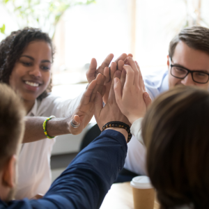 Man and woman business partners shaking hands on an in-kind donation deal