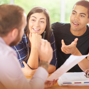 Stocks and Securities 1 Young couple discussing how to gift stocks as a charitable contribution