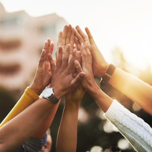 Man and woman business partners shaking hands on an in-kind donation deal